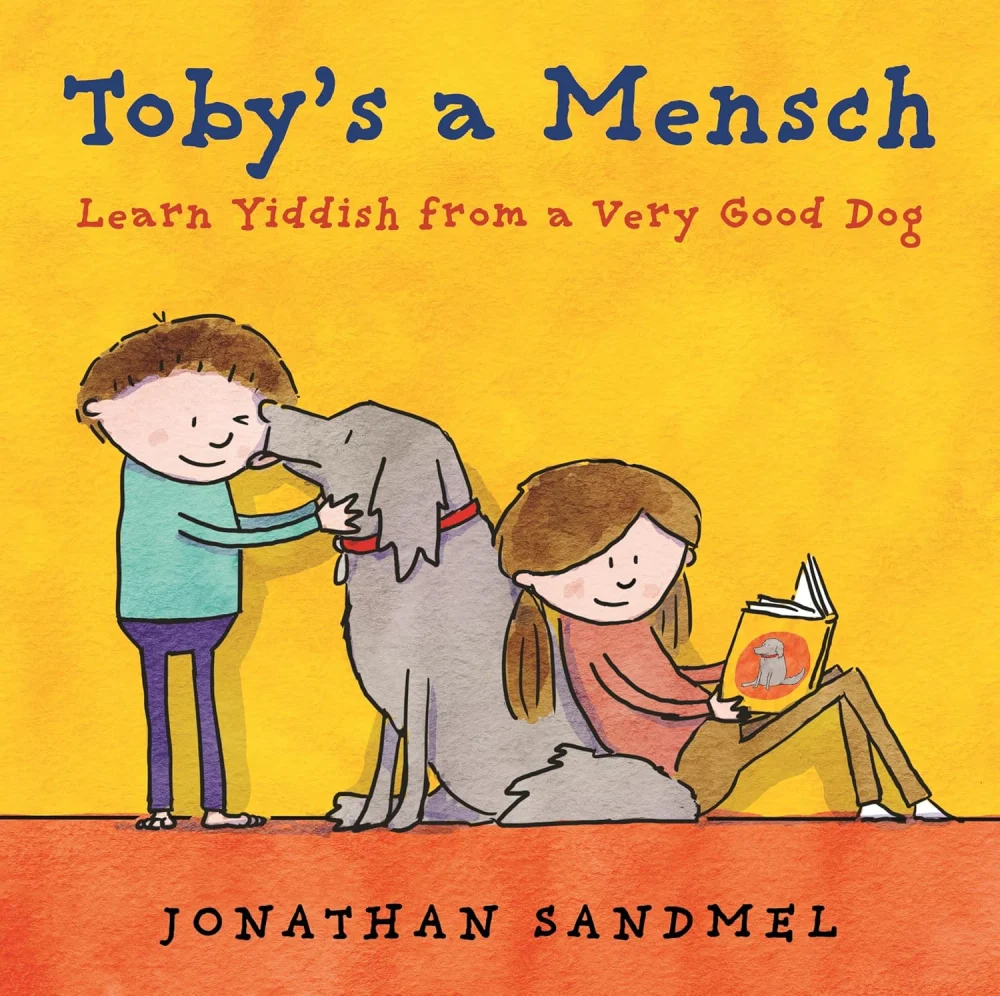Cover of Toby's a Mensch by Jonathan Sandmel: a three-legged dog being hugged by two children on a sunny yellow background